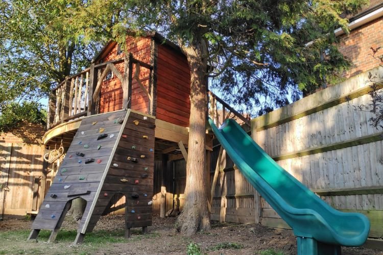 Tree House with a Slide for Extra Fun